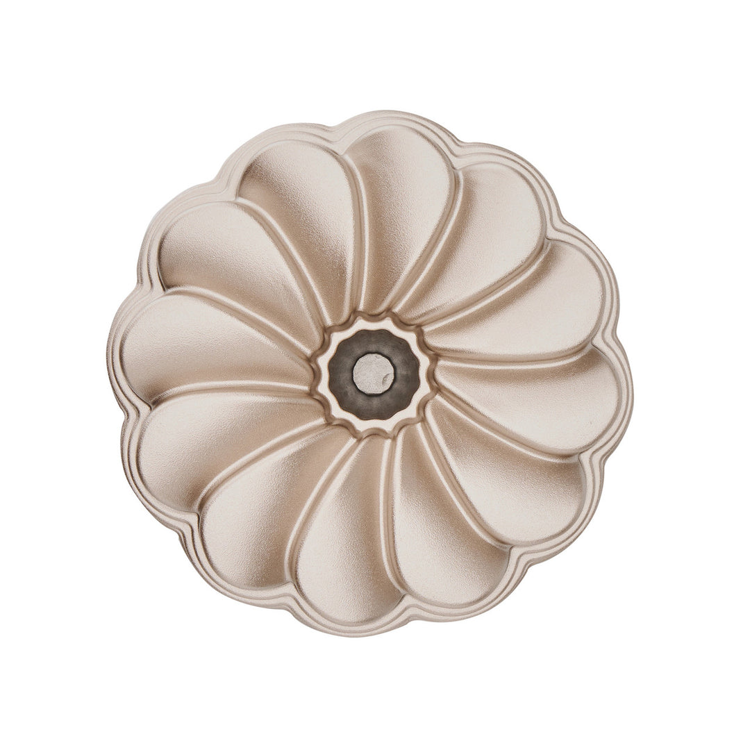 Decorative floral bundt cake tin on a white background