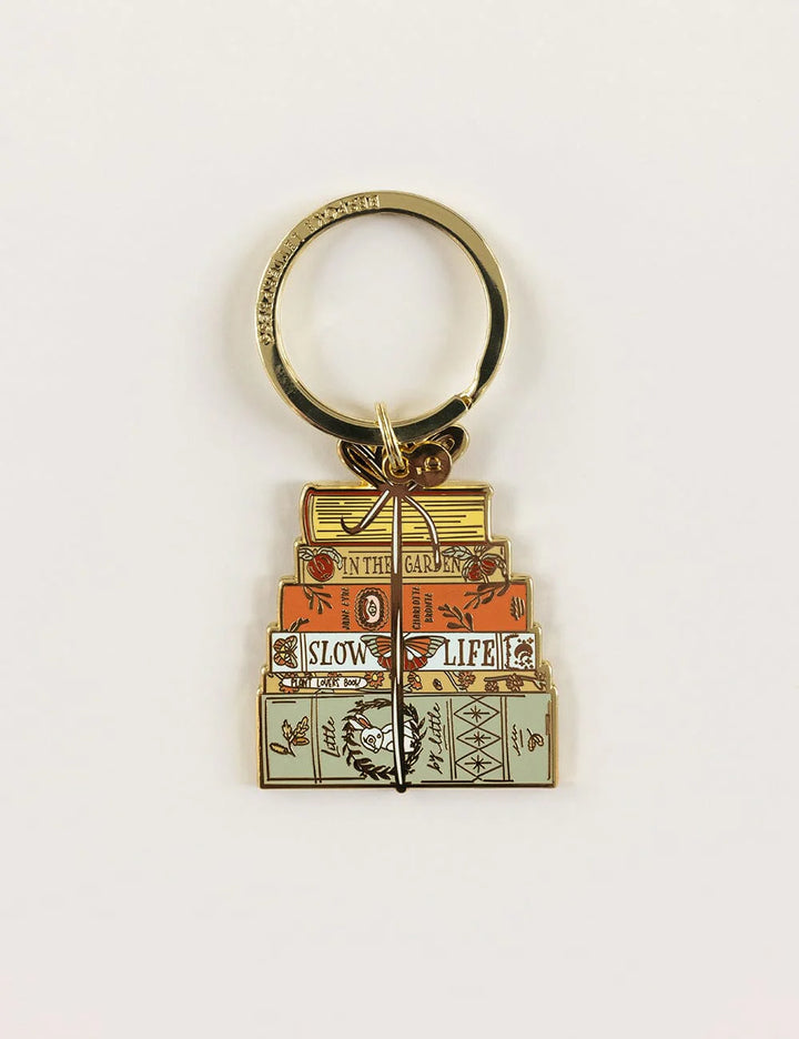 Keychain with stacked books design on a white background