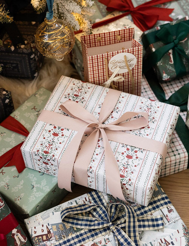 Decorative Christmas presents with ribbons on a wooden surface
