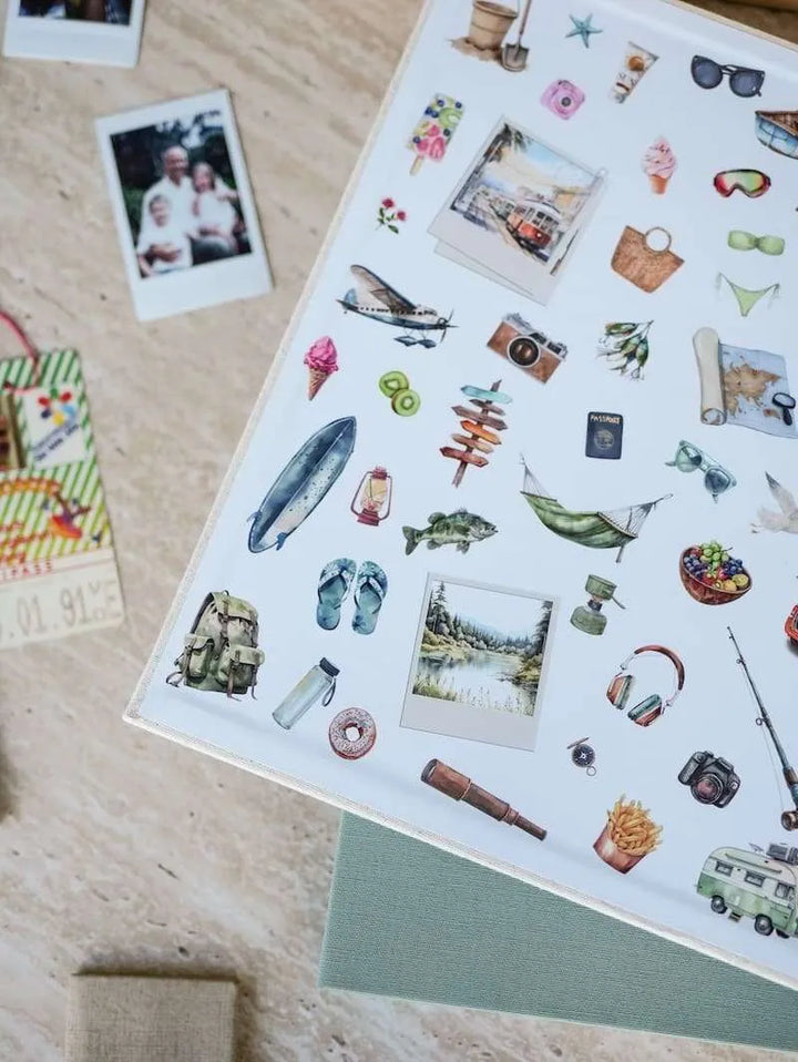 Sheet of decorative stickers with various designs on a wooden surface.