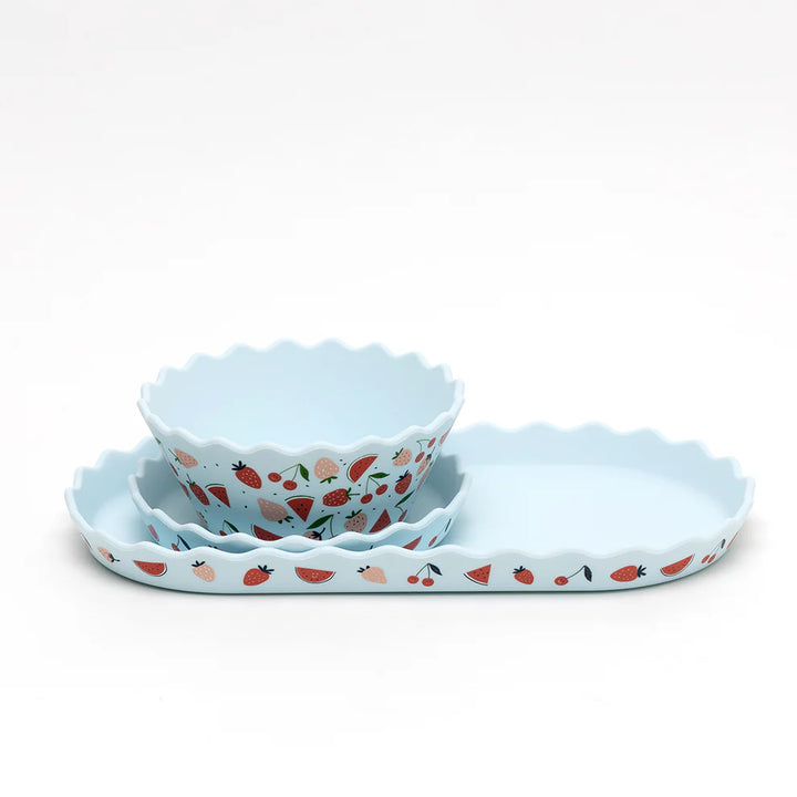 Set of three silicone bowls with a fruit pattern on a white background