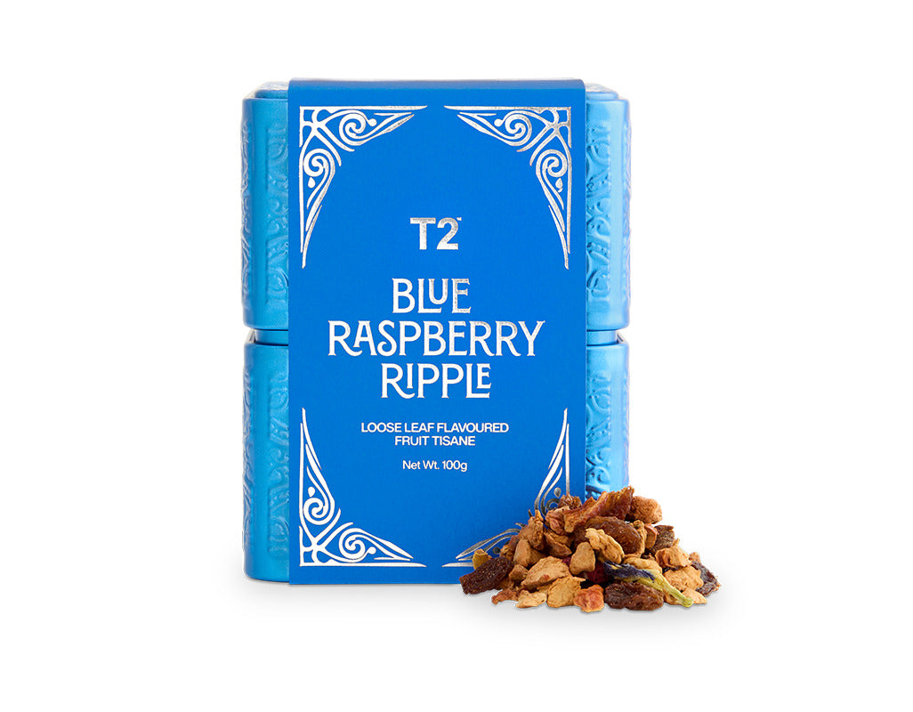 T2 Blue Raspberry Ripple tea packaging with loose tea leaves on a white background