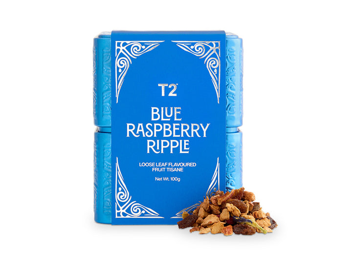 T2 Blue Raspberry Ripple tea packaging with loose tea leaves on a white background