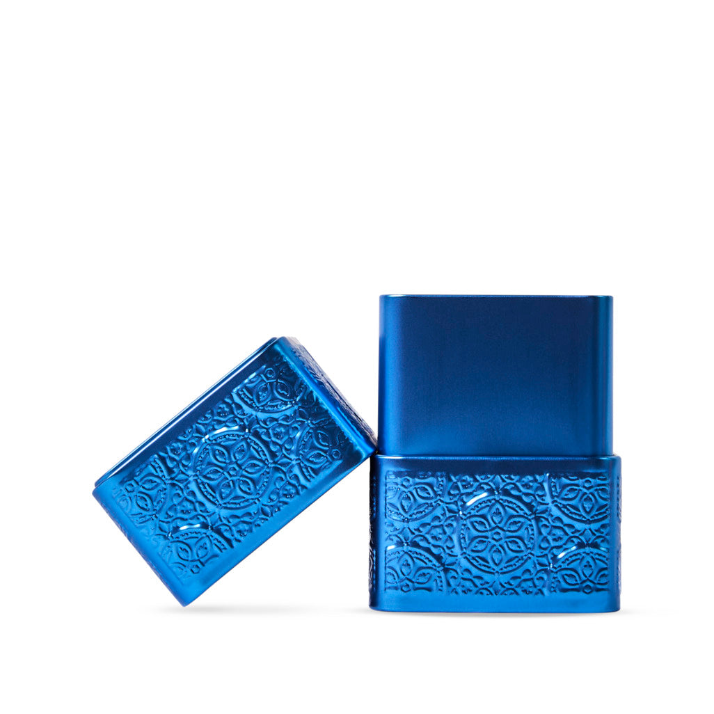 Two blue metallic boxes with embossed patterns on a white background