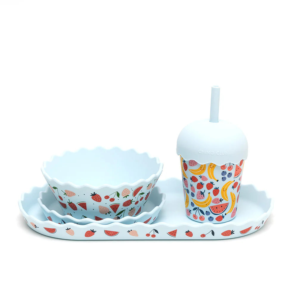 Children's tableware set with bowls and a cup on a white background