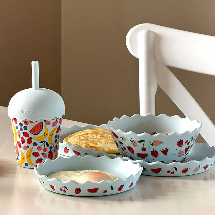 Set of silicone dishes with a fruit pattern on a neutral background