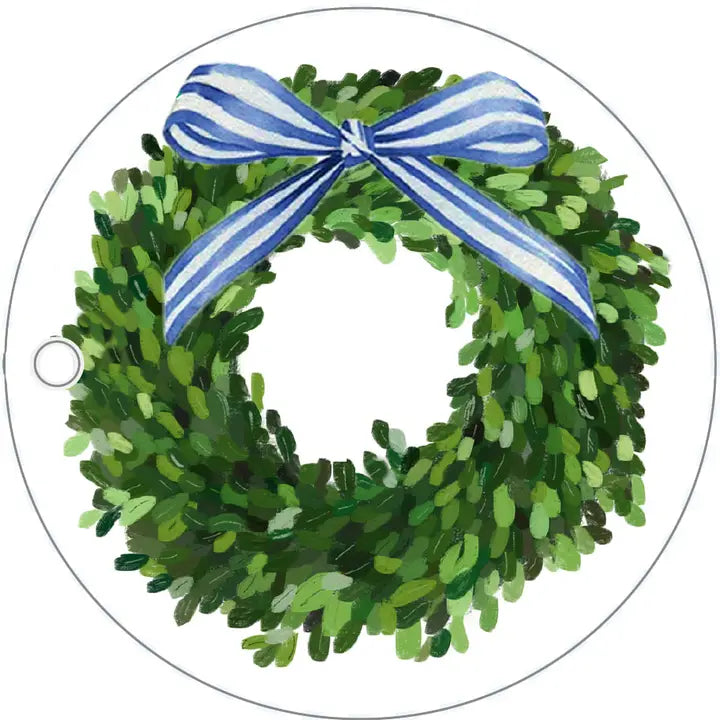 Green wreath gift tag with a blue and white striped bow on a white background