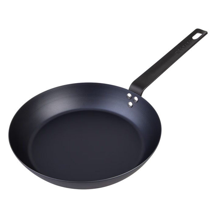 Black carbon steel frying pan on a white background