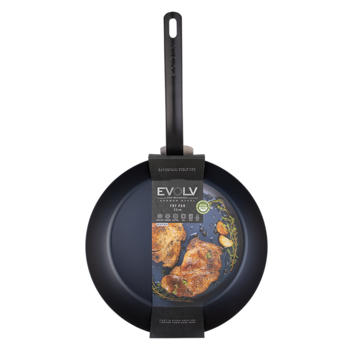 Black carbon steel frying pan with a handle and &