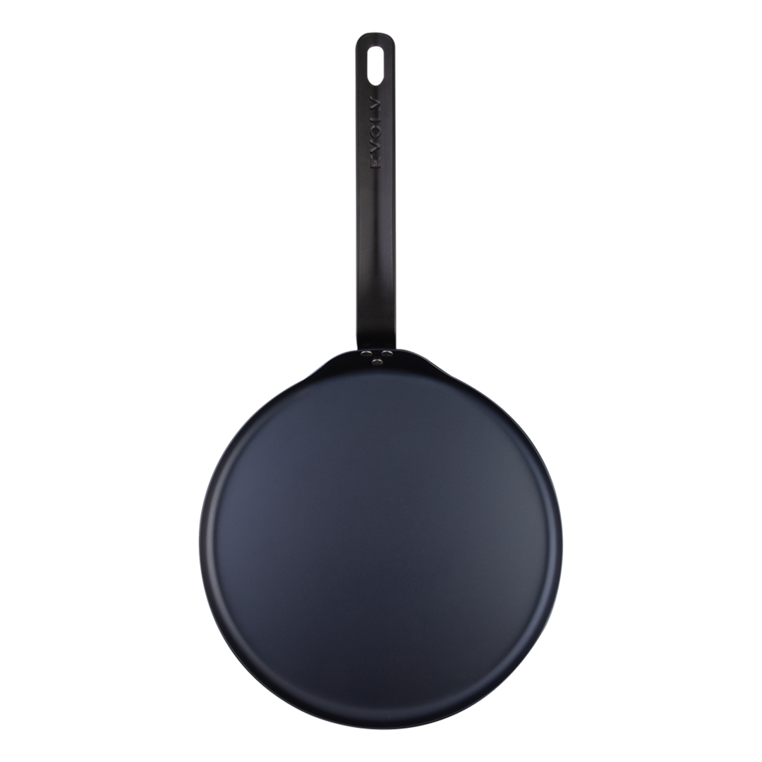Black carbon steel pancake pan on a white background
