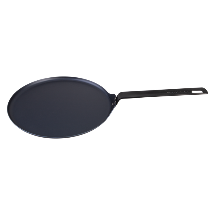 Black carbon steel pancake pan on a white background