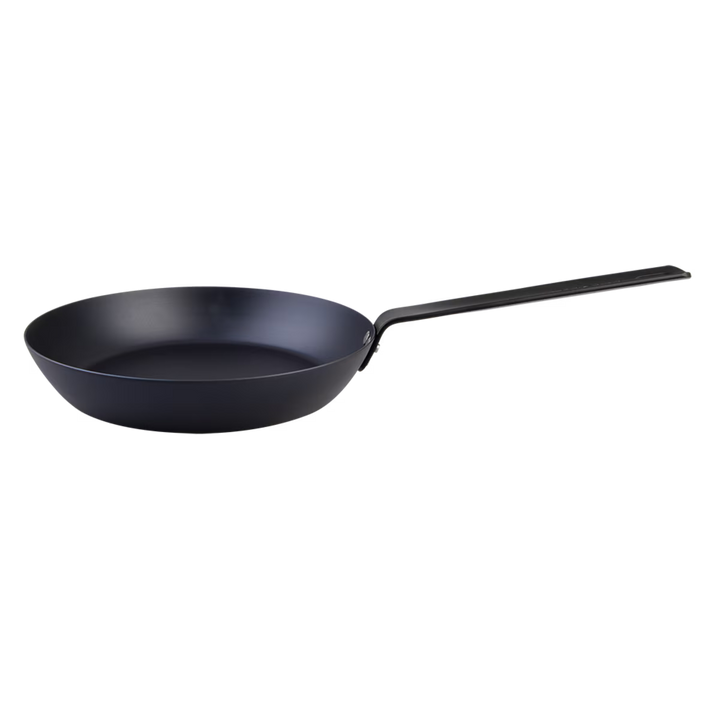 Black carbon steel frying pan on a white background
