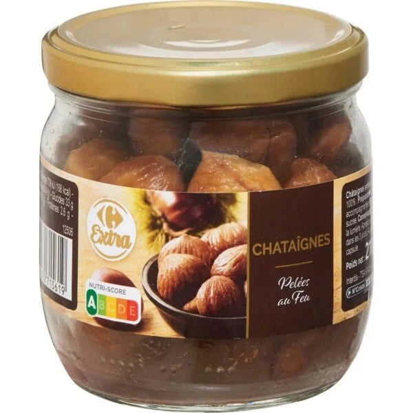 Jar of roasted chestnuts with a gold lid on a white background