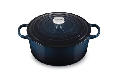 Blue cast iron cookware pot on a white background