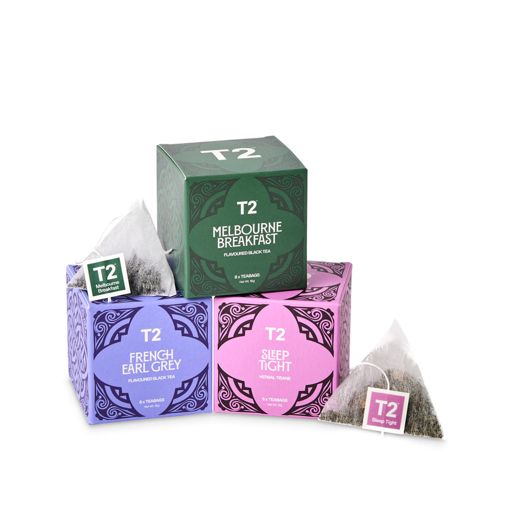 T2 tea packaging including boxes and bags on a white background