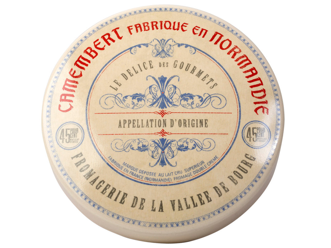 Camembert cheese baker with decorative label on a white background
