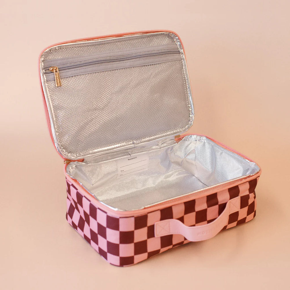 Checkered lunch box with pink border on a beige background