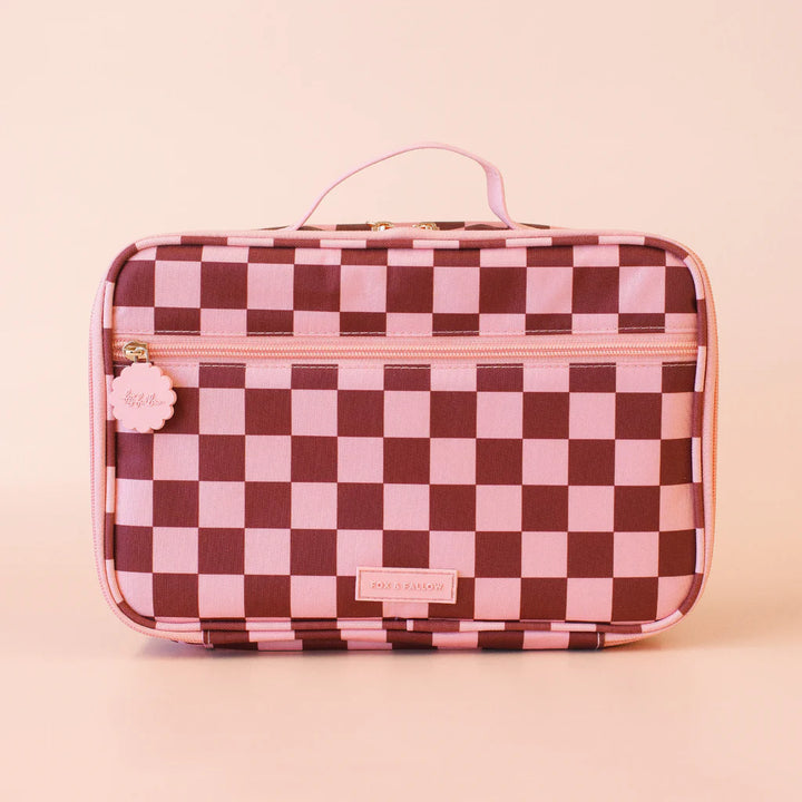 Checkered makeup bag with pink and brown pattern on a beige background