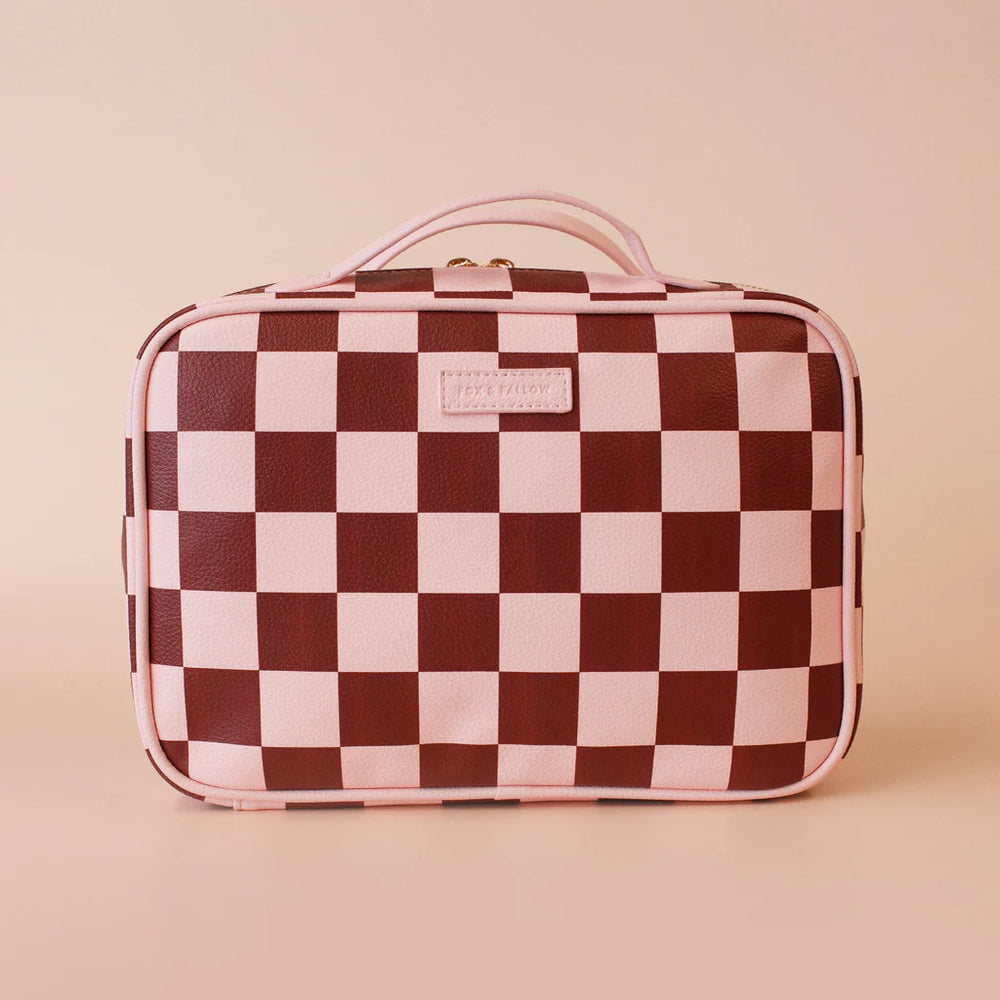 Checkered cosmetic bag with a visible brand label on a beige background