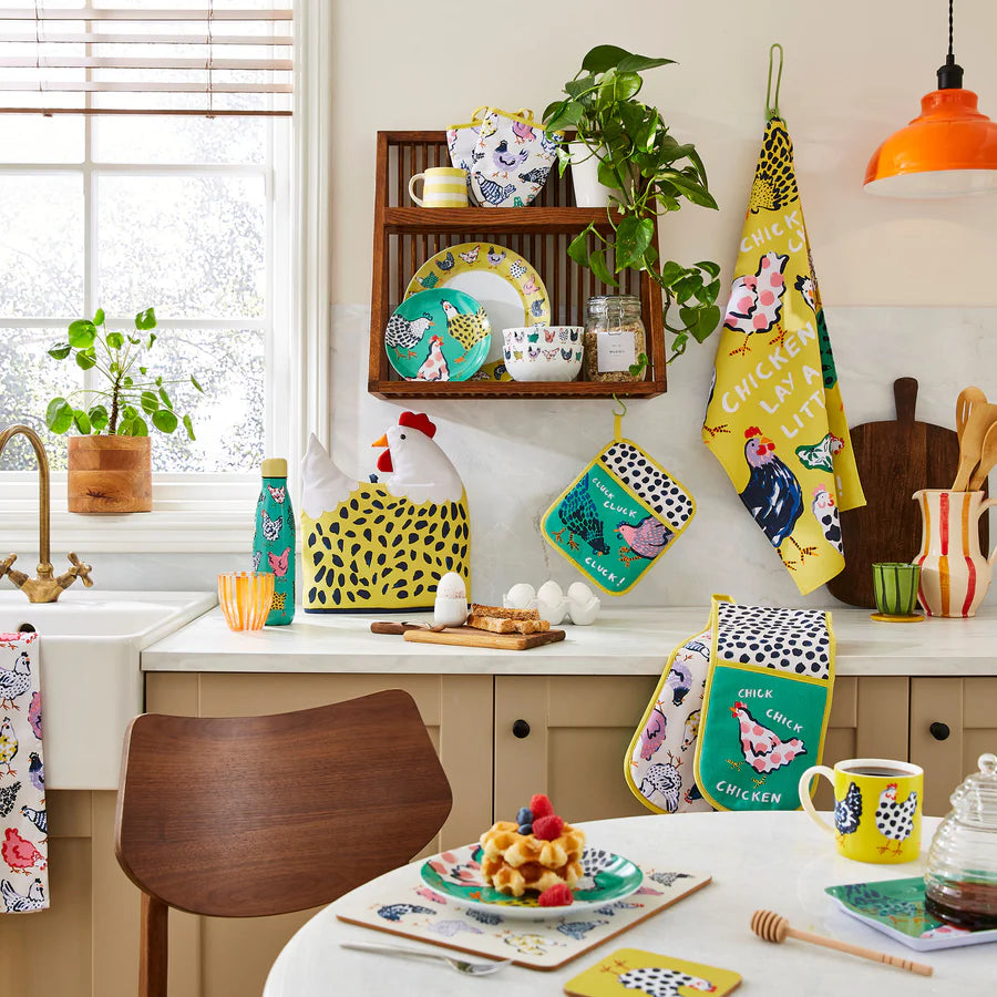 Kitchen with colorful chicken-themed decor and kitchenware.