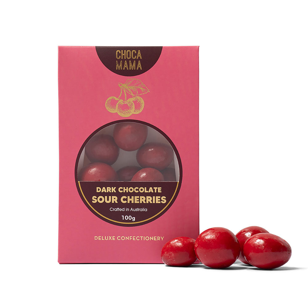 Pink packaging of Choca Mama dark chocolate sour cherries with red cherries in front