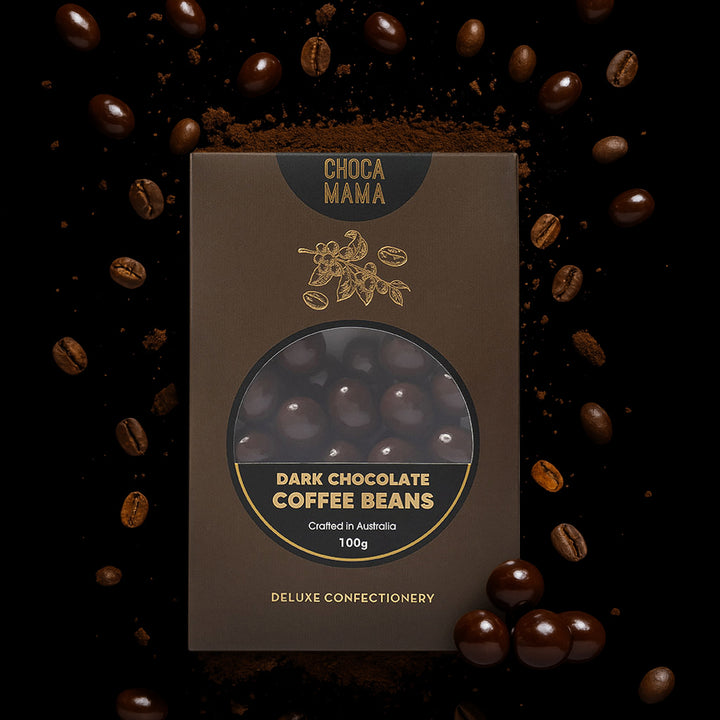 Box of Choco Mama Dark Chocolate Coffee Beans surrounded by coffee beans on a dark background