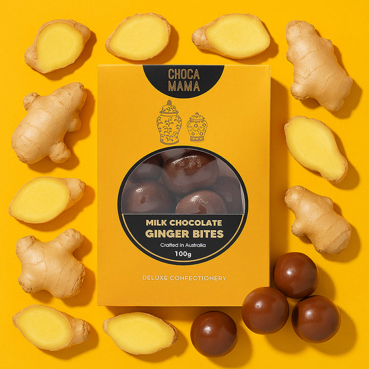Box of ChocaMama Milk Chocolate Ginger Bites surrounded by ginger on a yellow background