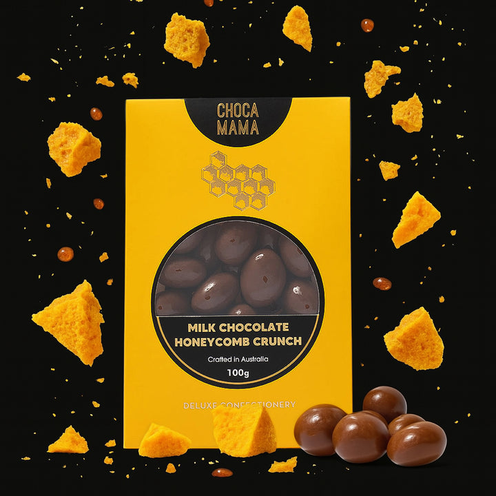 Yellow packaging of ChocaMama Milk Chocolate Honeycomb Crunch with honeycomb pieces around on a black background