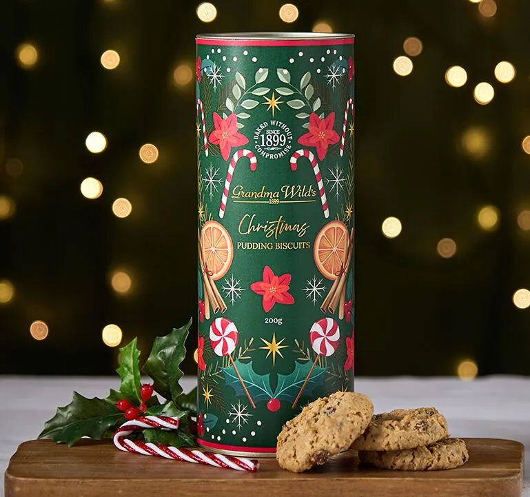 Canister with christmas motifs and christmas cookies in a board 