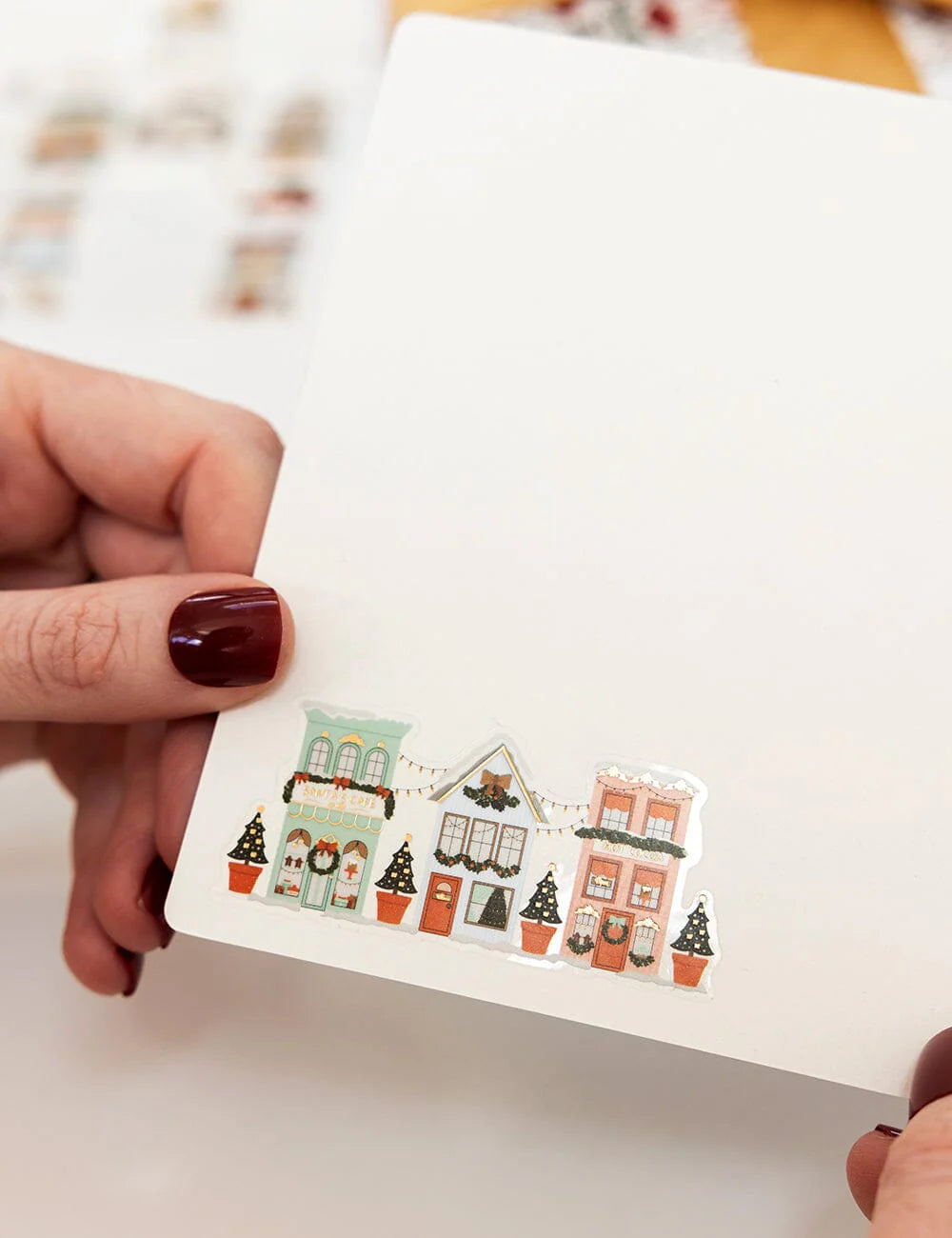 A christmas card with a christmas sticker in it
