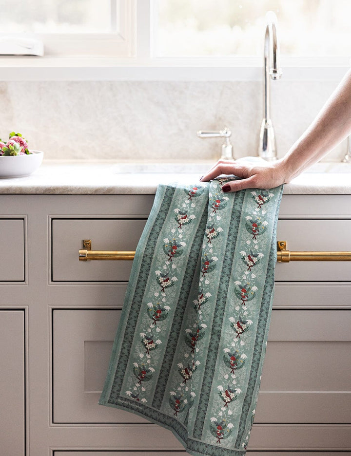 Christmas theme teatowel on a kitchen sink