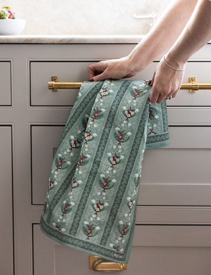 Christmas theme tea towel over a kitchen drawer handle