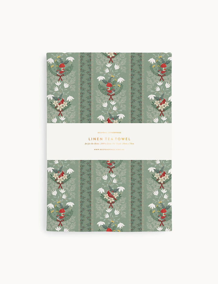 Christmas linen tea towel on a white background