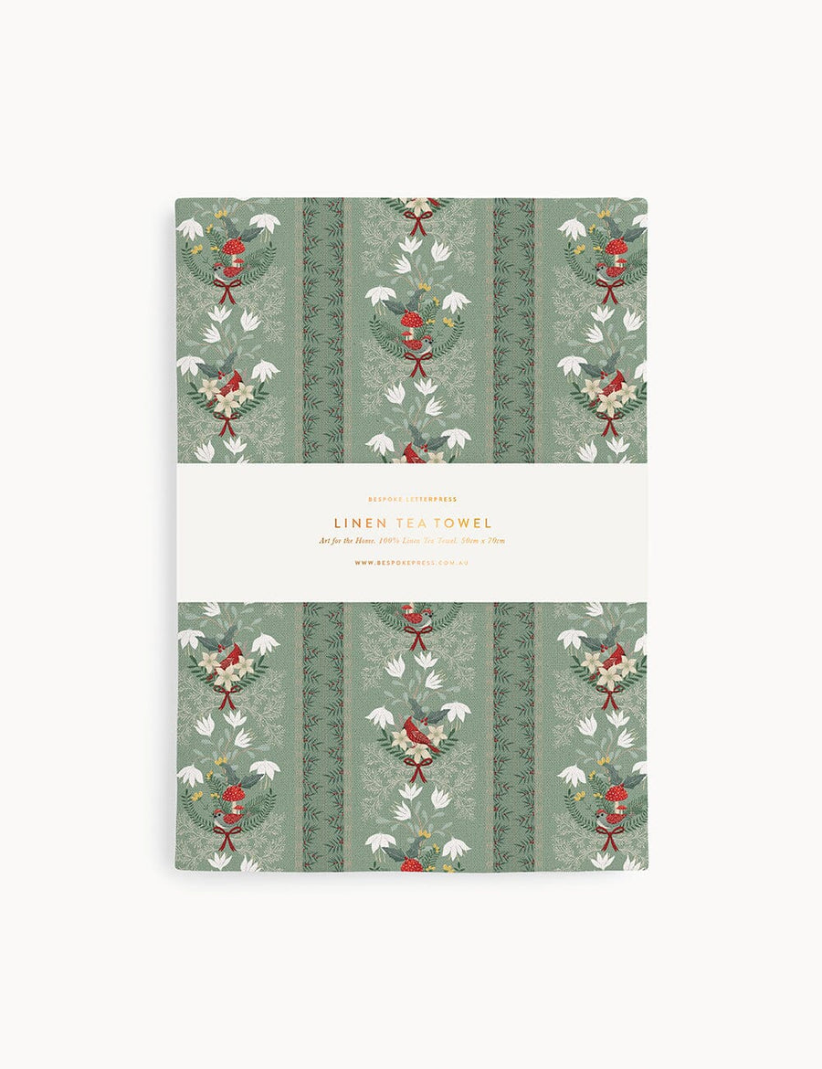 Christmas linen tea towel on a white background