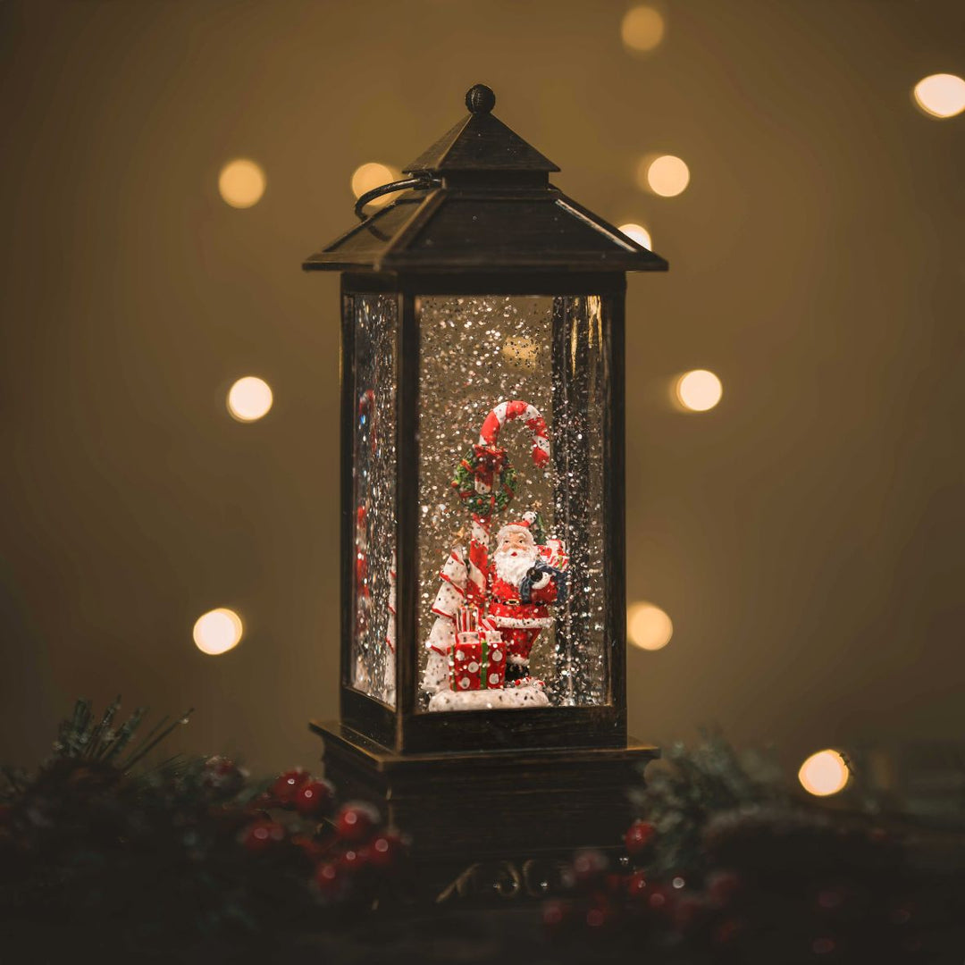 Christmas now globe lantern with santa, candy cane and gifts