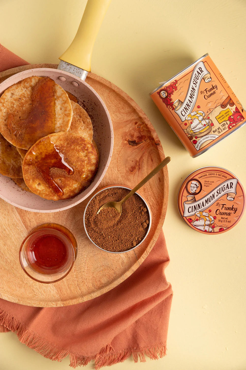 Cinnamon sugar treats with a box of cinnamon sugar on a yellow background