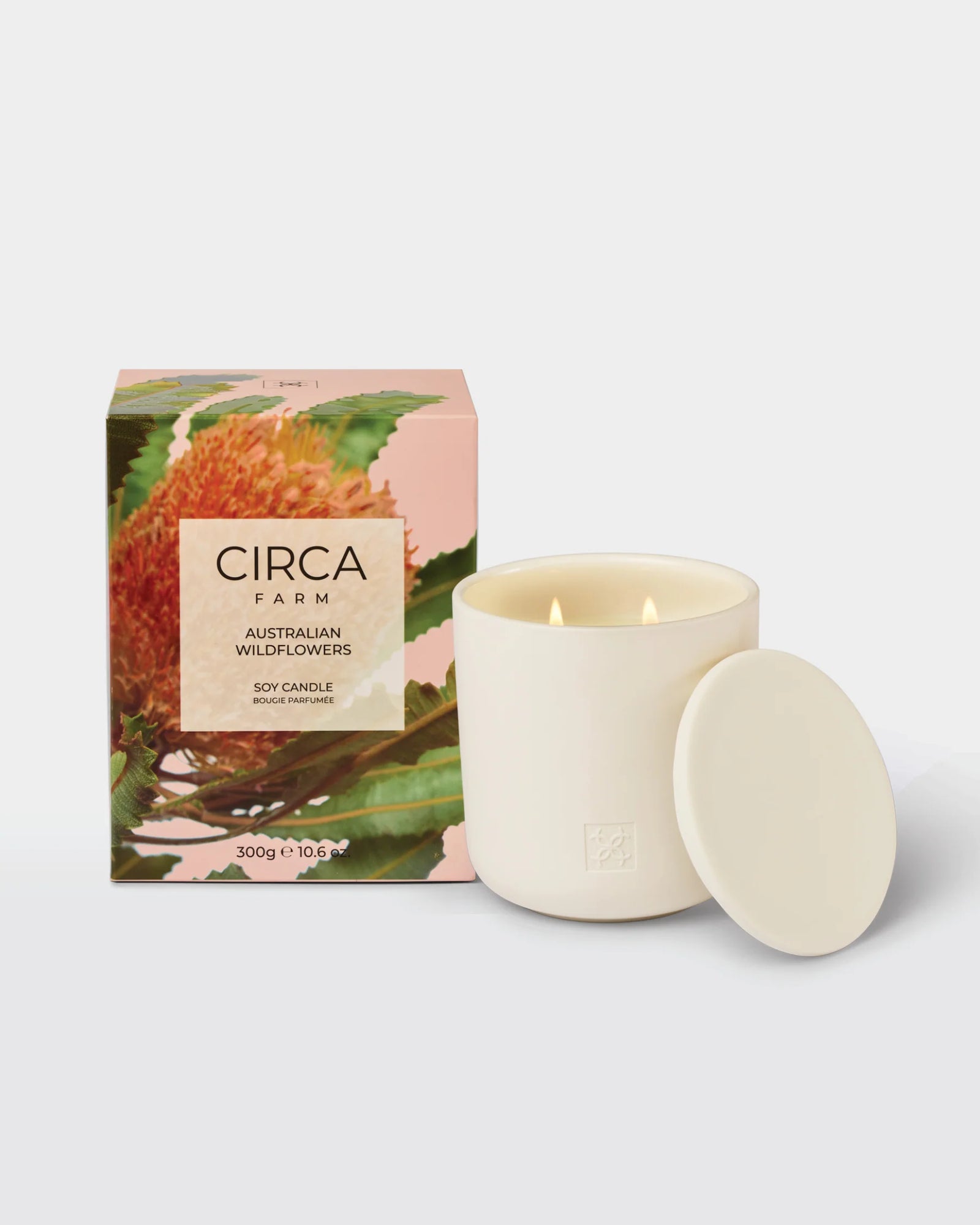 Candle with packaging featuring 'Circa Farm' branding with a floral background on a white background