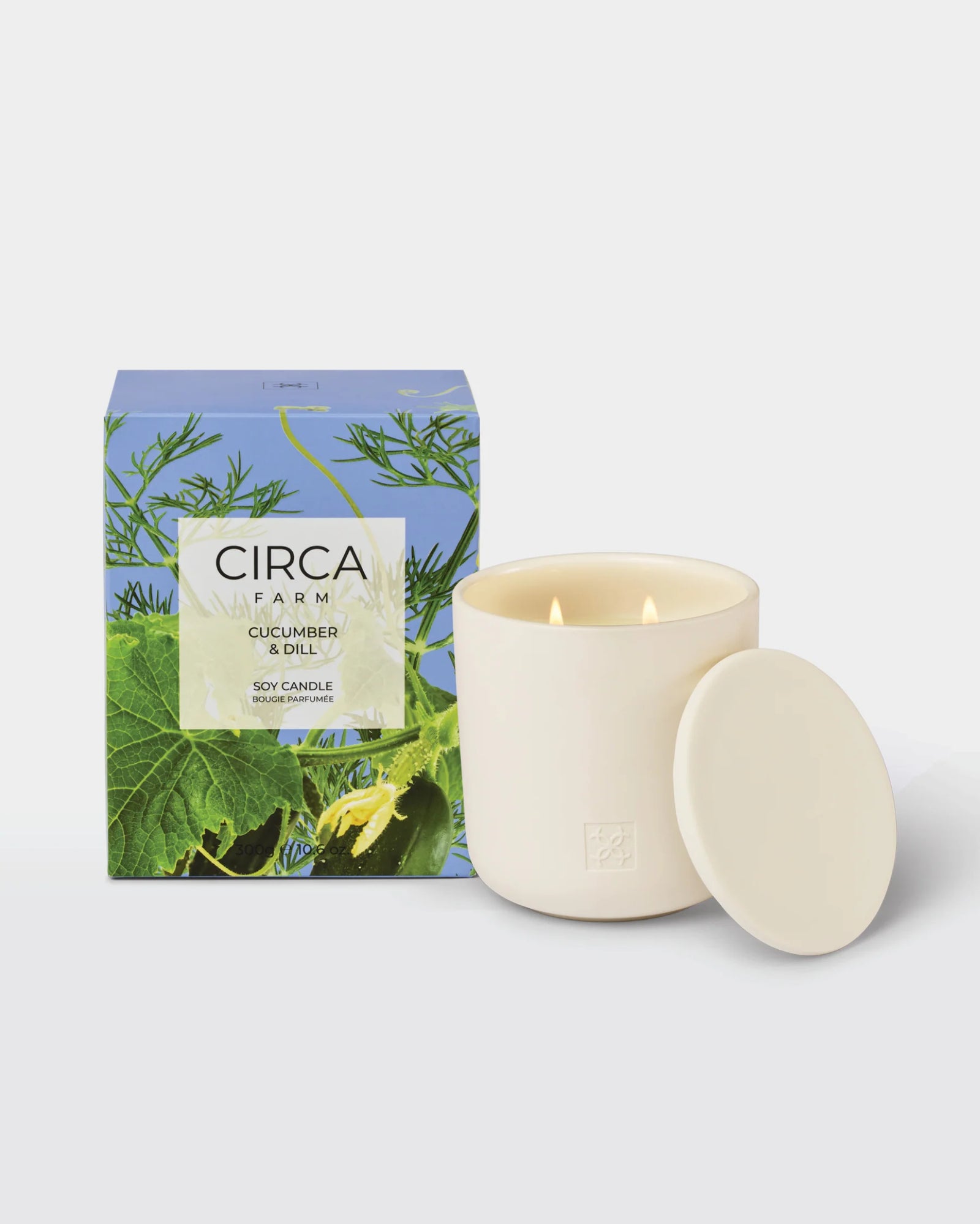 Candle with packaging featuring 'Circa' branding and nature-themed design on a white background