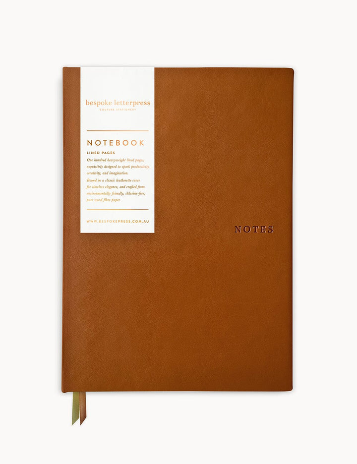Brown notebook with a white label on a white background