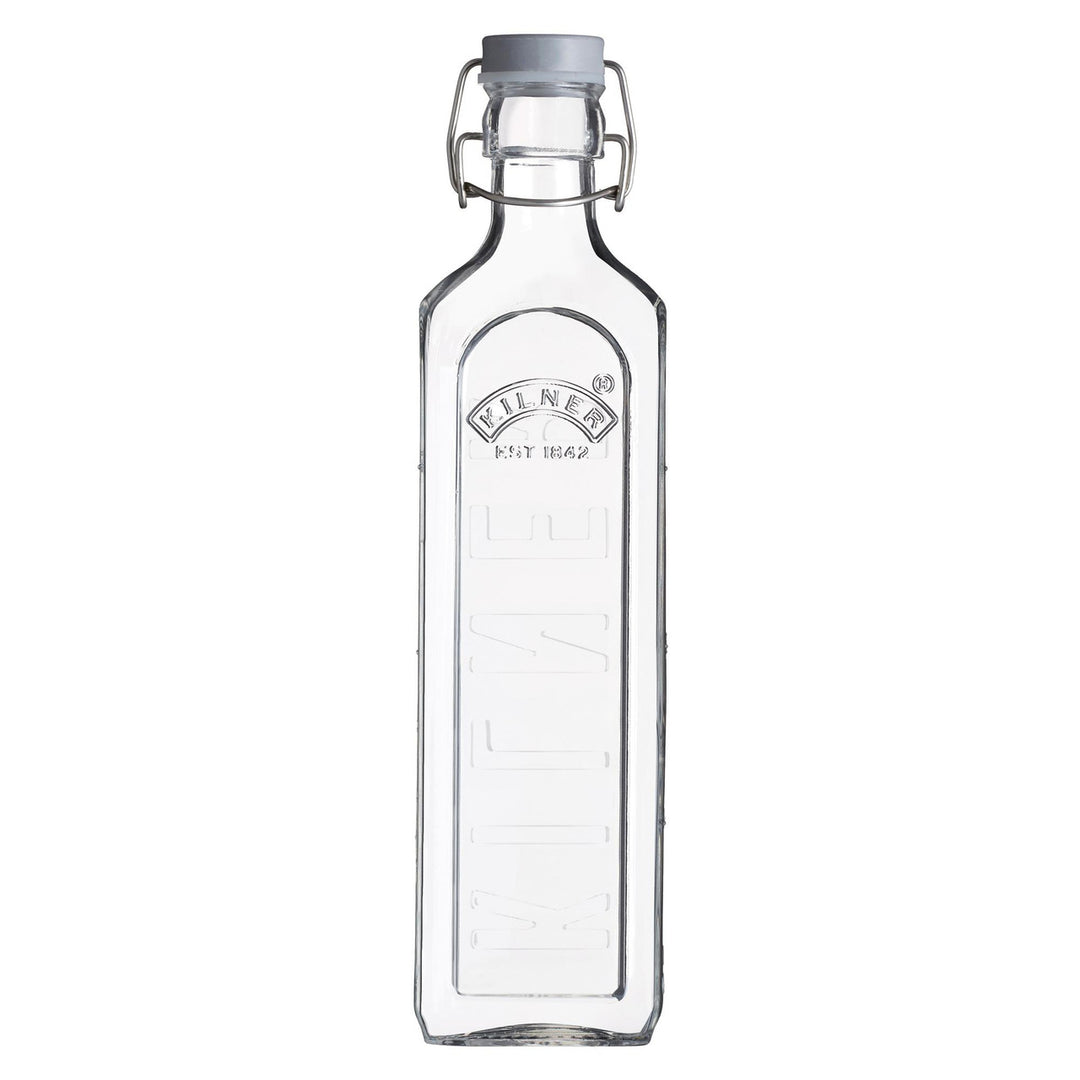 Clear glass bottle with a metal cap on a white background