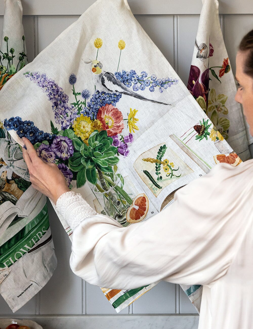 Linen tea towel with flowers a cockatiel on it 