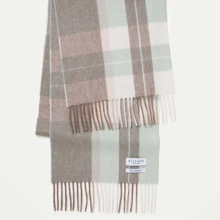 Plaid scarf with fringes on a white background