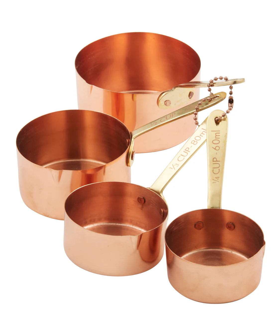 Set of copper measuring cups with gold handles on a white background