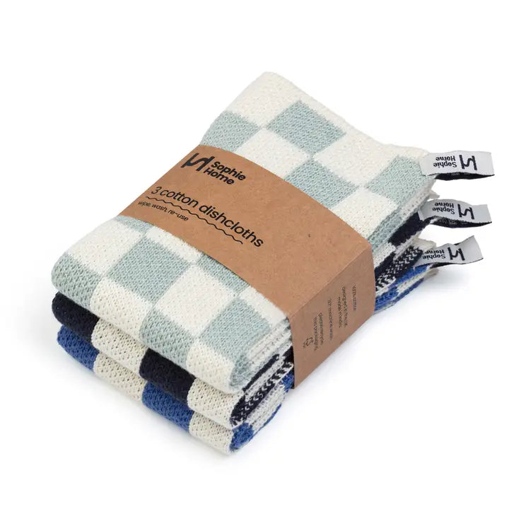 Set of checkered cotton dishtowels with a branded cardboard packaging on a white background