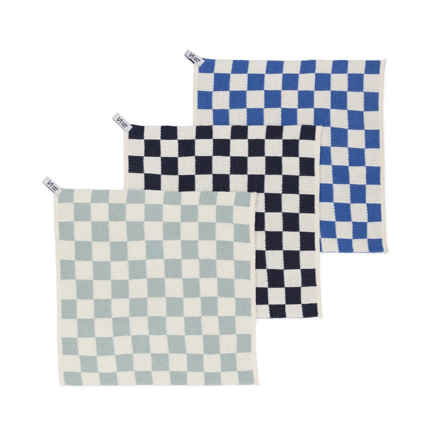 Three checkered dish cloths in blue, navy, and light blue on a white background