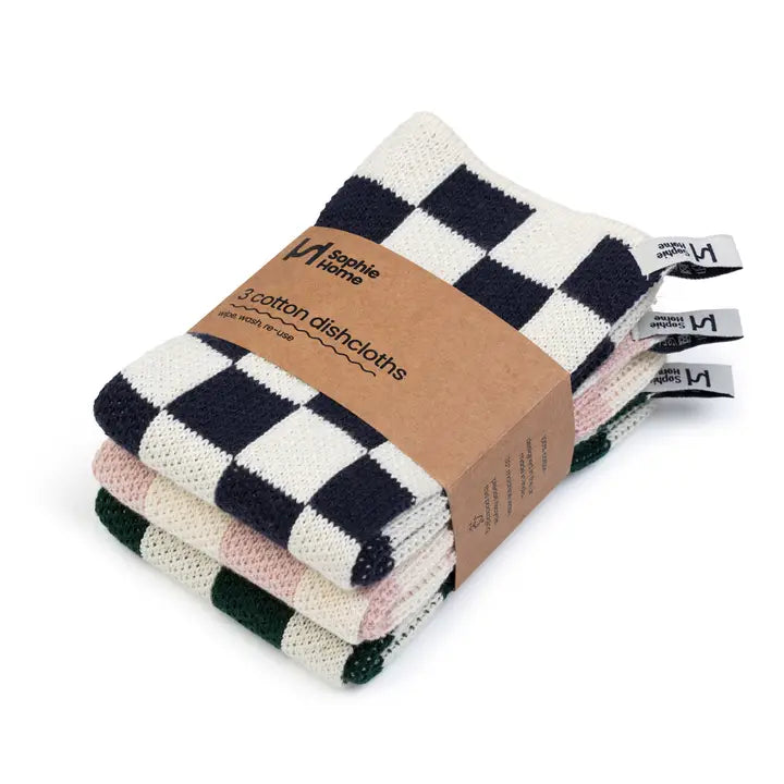 Stack of checkered cotton dishtowels with a brown paper bag label on a white background