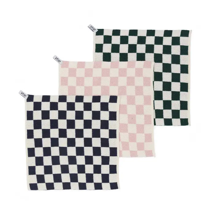 Set of three checkered dish cloths in green, pink, and navy on a white background