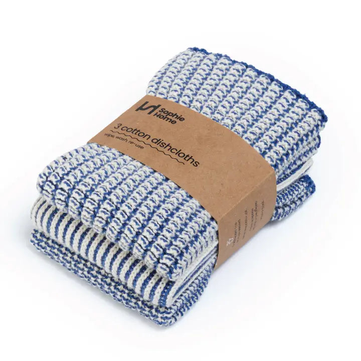 Set of three blue and white patterned cotton dishcloths with a cardboard packaging label on a white background.