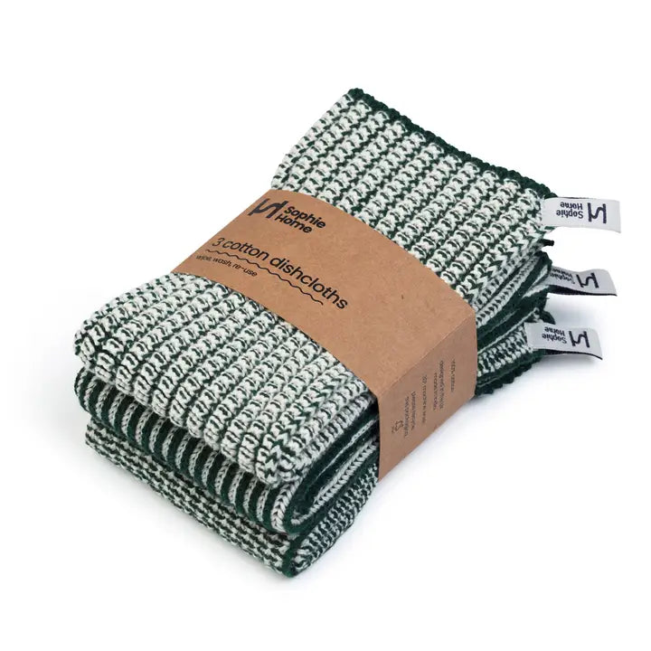 Set of green and white patterned cotton dishcloths with a cardboard packaging label on a white background.