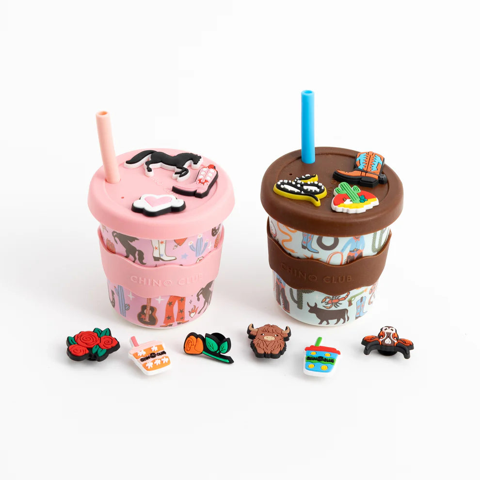 Two colorful drink containers with decorative elements on a white background